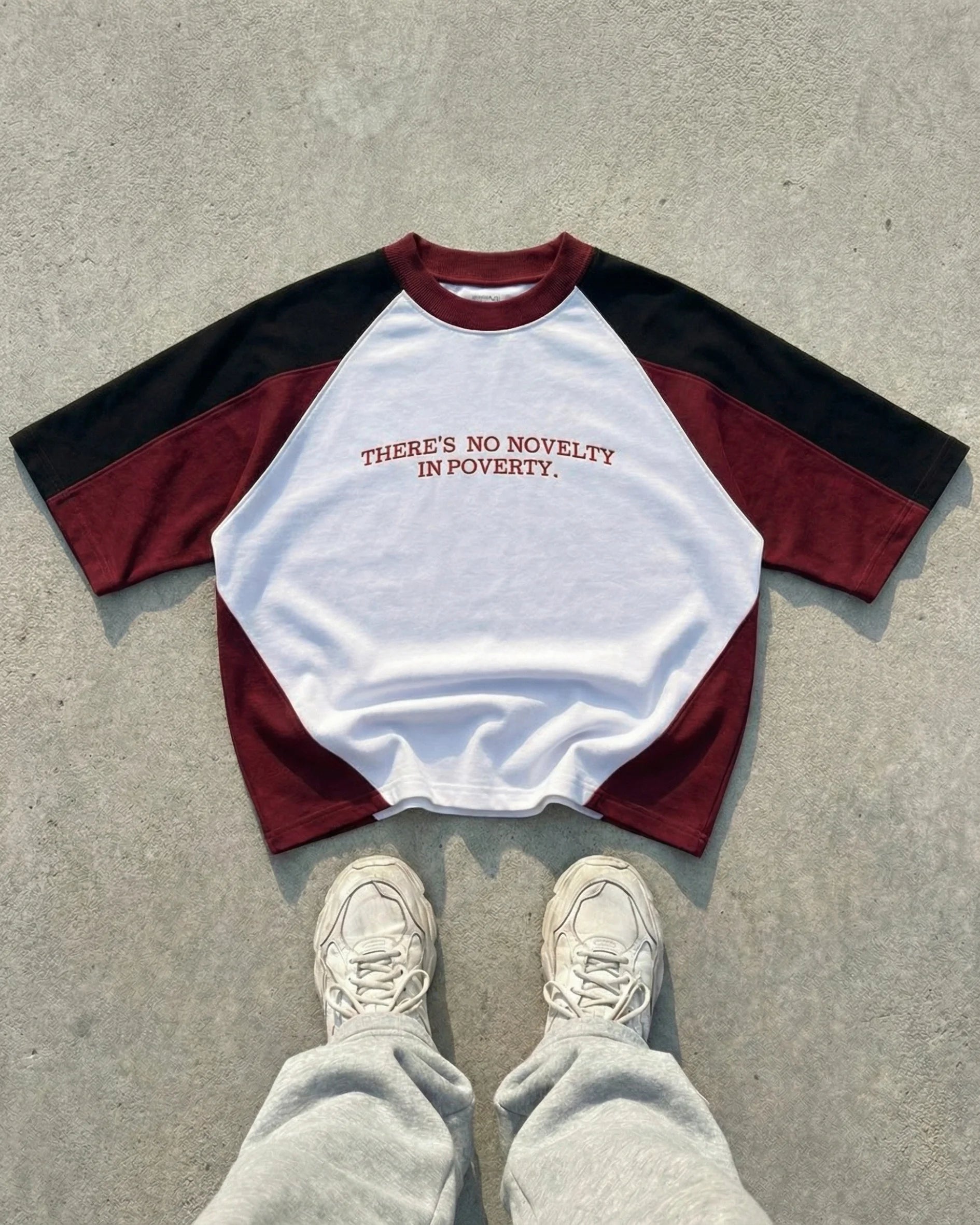 NO NOVELTY IN POVERTY TEE