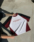 NO NOVELTY IN POVERTY TEE