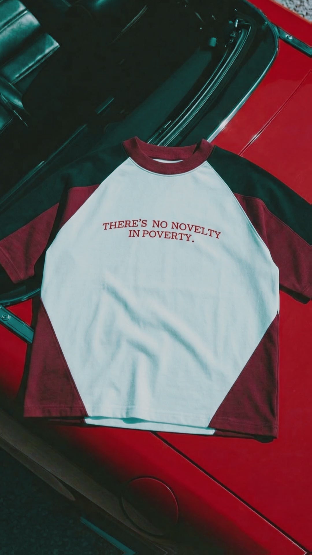 NO NOVELTY IN POVERTY TEE